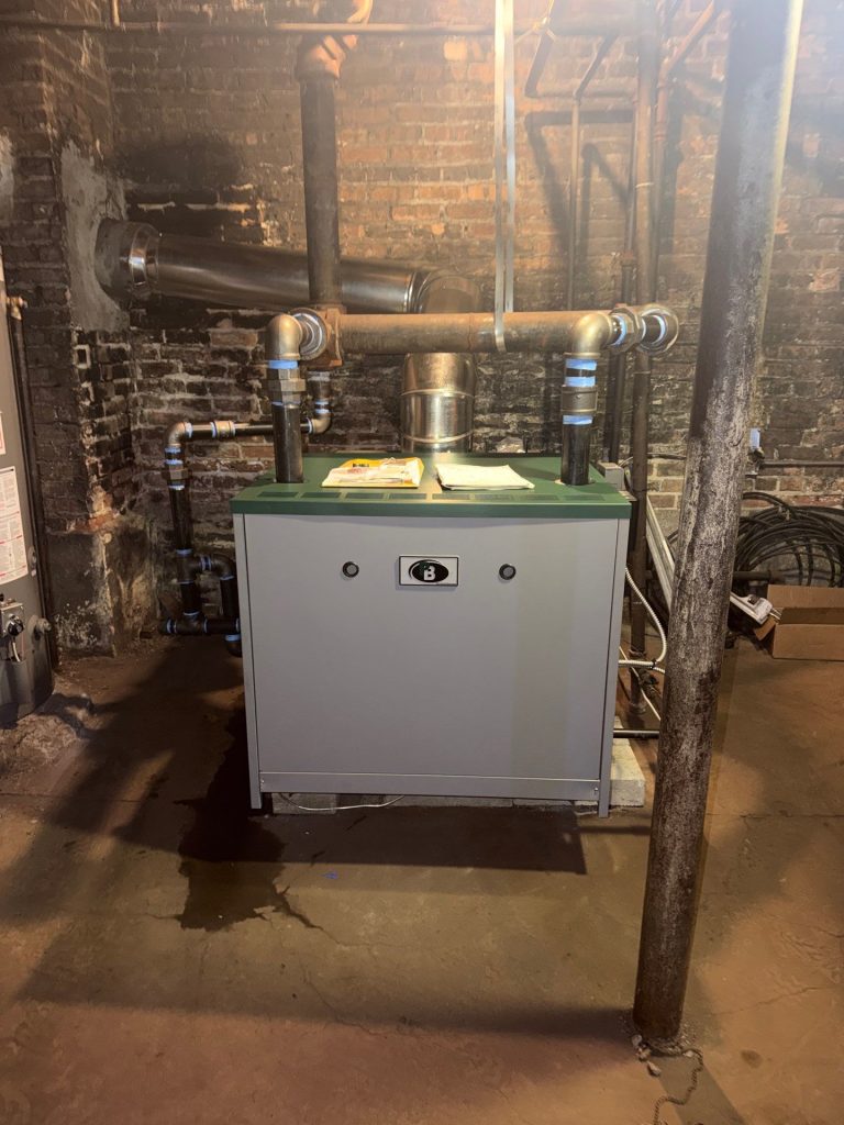 Finished install: new Peerless 400,000 BTU steam boiler in a Chicago three-flat